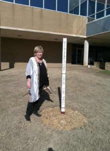 Annie Malloy with TCC's recently planted peace pole